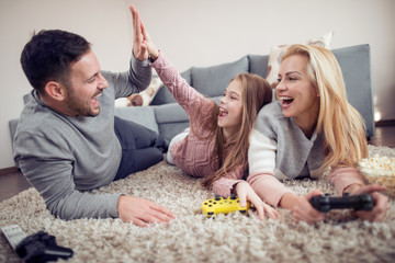 Poster - Family playing playstation at home