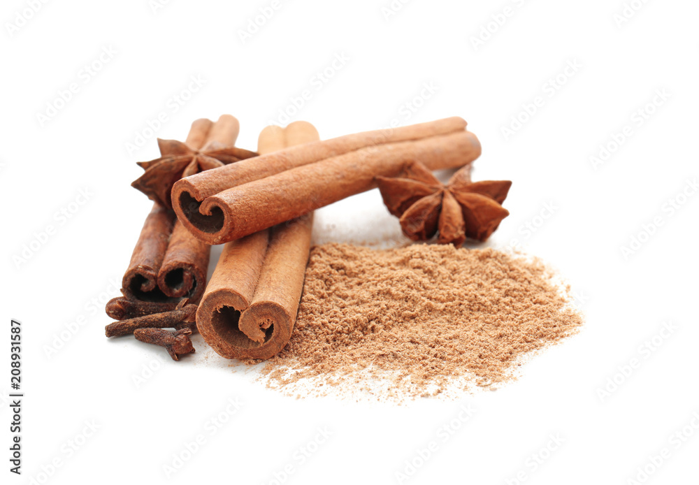 Cinnamon sticks and powder on white background