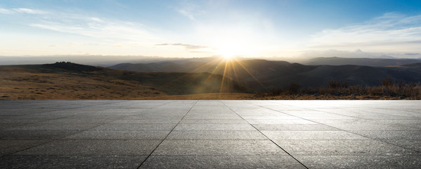 empty brick ground with sunrsise