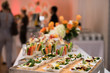 © Nick Starichenko - Healthy organic gluten-free delicious green snacks salads on catering table during corporate event party