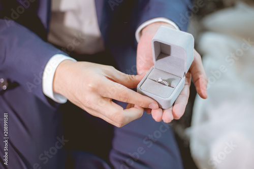 Cuadros en Lienzo Man open a diamond ring box for marry his girlfriend.