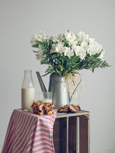 White Flowers And Tasty Breakfast With Muffins