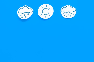 Wall Mural - modern weather icons set on blue background top view copy space