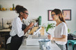 © Joshua Resnick - friendly african american waitress taking order on notepad from customer