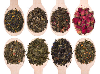 Wall Mural - Set of different dry herbal teas in wooden spoons isolated on a white background. View from above.