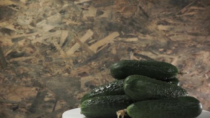 Poster - Fresh cucumber on a white table, rotation 360 degrees. Beautiful white background.