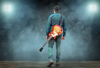 Artist Guitarist hands play on electricity guitar under light, P