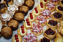 Rows Of A Variety Of Cooked Desserts Close-up In The Display Case.