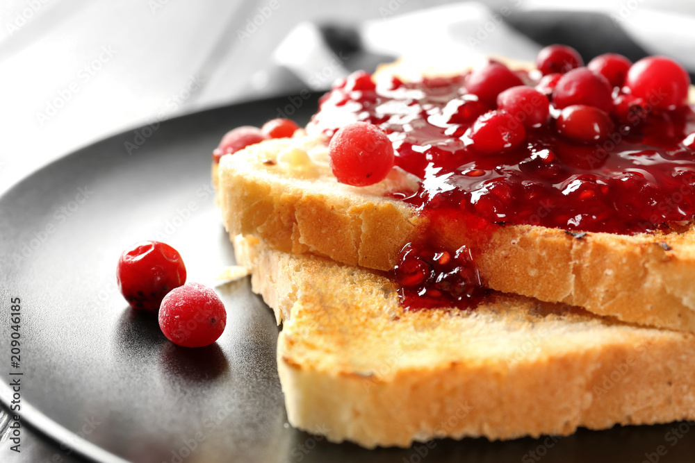 Plate with tasty sweet toasts on table, closeup
