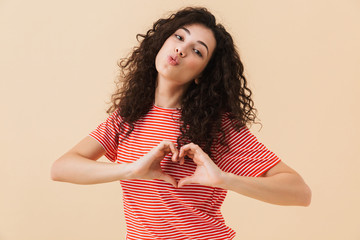 Poster - Happy young woman make heart love gesture blowing kisses.