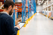 © Stock Rocket - Manager holding digital tablet in warehouse