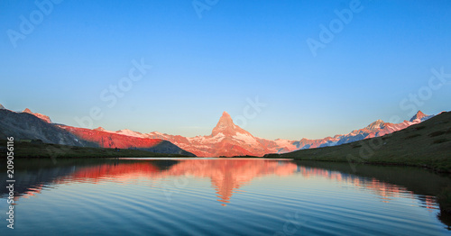 Leinwand Poster  Matterhorn Mountain with white snow and blue sky in Zermatt city in Switzerland
