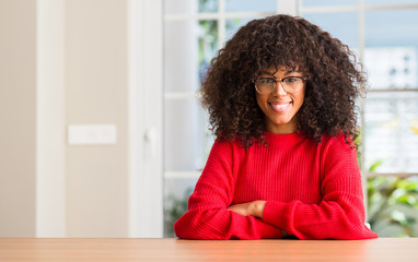 Poster - African american woman wearing glasses with a happy face standing and smiling with a confident smile showing teeth