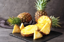 Slate Plate With Delicious Cut Pineapples On Table
