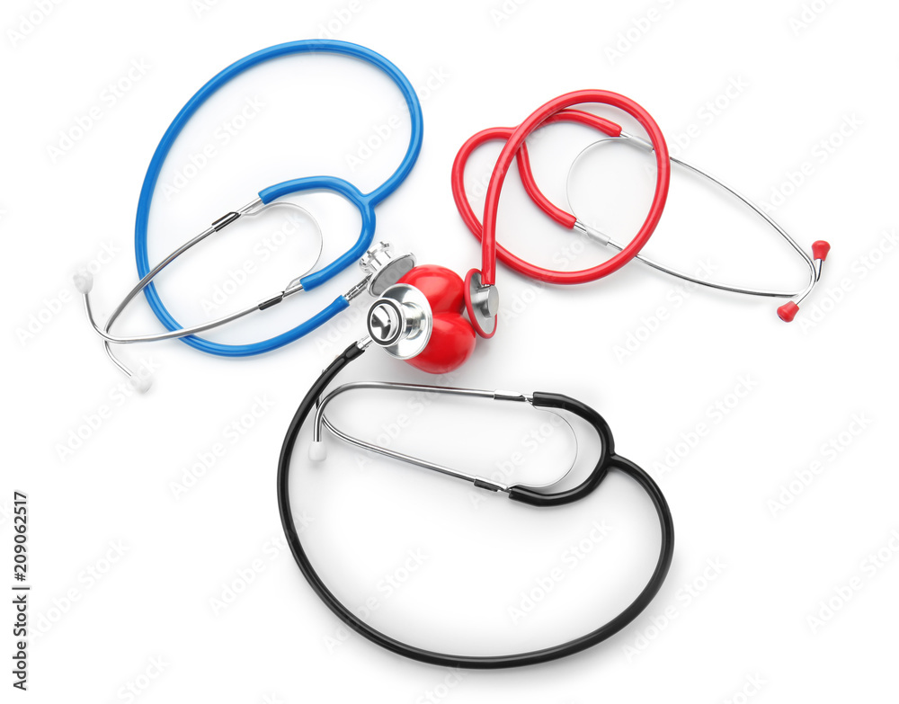 Medical stethoscopes with heart on white background. Health care concept