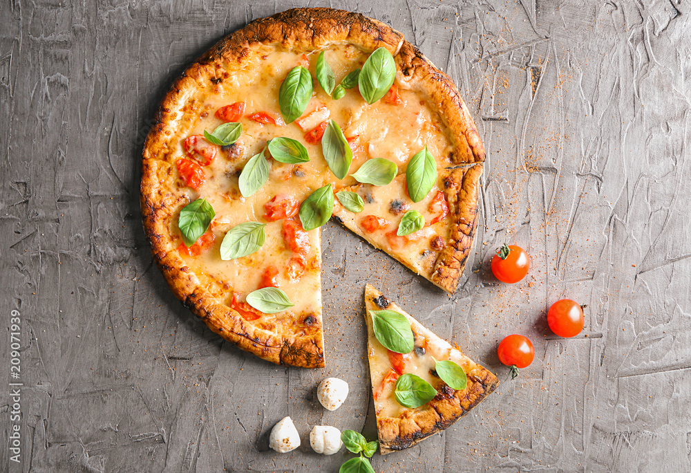 Composition with delicious pizza Margherita on grey background