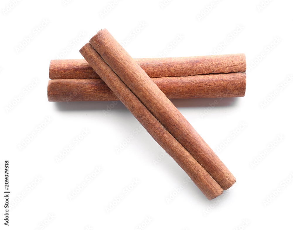 Aromatic cinnamon sticks on white background