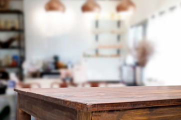 Wall Mural - Selected focus empty brown wooden table and Coffee shop blur background with bokeh image. for your photomontage or product display