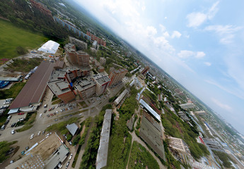 Wall Mural - Aerial view of old and new russian buildings in green area in the city with a lot of cars. Cut by side tilted planet panorama 360 degrees wth skyscrapers.