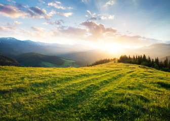 sunset in the mountain valley. beautiful natural landscape in the summer time