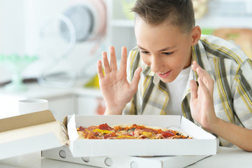 Wall Mural - Young boy with pizza