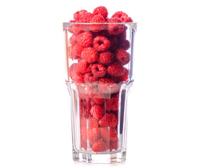 Canvas Print - A glass of raspberries on a white background isolation