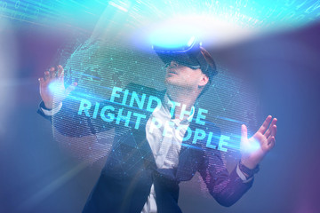 Wall Mural - Business, Technology, Internet and network concept. Young businessman working in virtual reality glasses sees the inscription: Find the right people