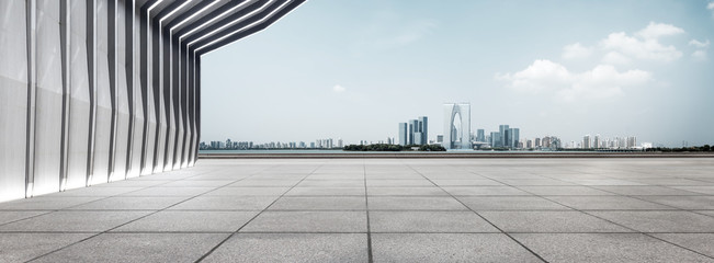 Fototapete - modern building and empty floor with skyline