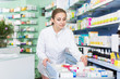 © JackF - Woman pharmacist is looking different medicines in apothecary