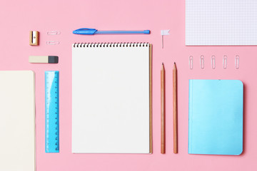 set of stationery on a colored background with space for text. back to school. office tools. flat lay, top view