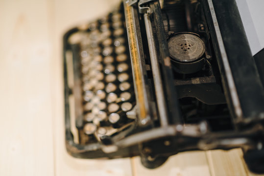 Details of an old retro typewriter, vintage style, dusty surfaces.