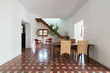 © bisualstudio/Stocksy - Modern dining room with typical old floor in a country house, Spain