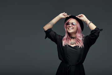 Portrait of fashionable girl with pink hair