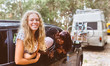 © Marco Govel/Stocksy - Three young friends having fun looking out the window of a car
