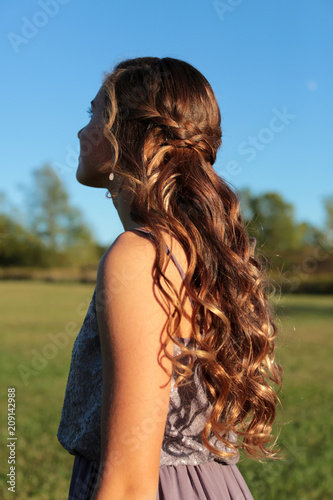 A Pretty Teen With Braids And Curls In Her Long Hair Ready