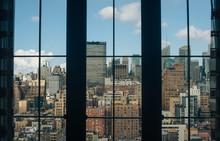 City Skyline Seen Through Window