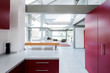 © phillipsvisuals/Stocksy - Modern Kitchen red foreground