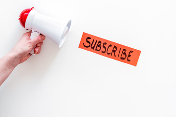 Poster - Subscribe template or mockup. Hand lettering subcribe near megaphone on white background top view space for text