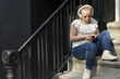 © Fjello/Stocksy - A young adult listening to music