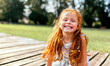© Marco Govel/Stocksy - Portrait of a smiling little redhead girl