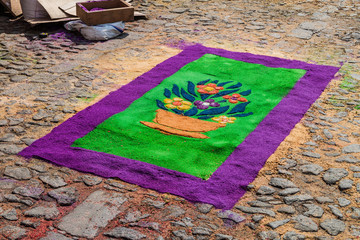 Detail of decorative Easter carpet in Antigua Guatemala town, Guatemala.