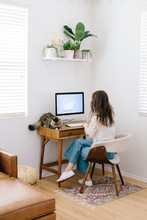 Young Woman Working On Computer In Home Office