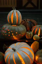 Carved Pumpkins Glowing In Night