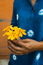 Asian Woman With Yellow Flowers