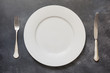 Table place setting on gray. Top view. Concept. Minimalism
