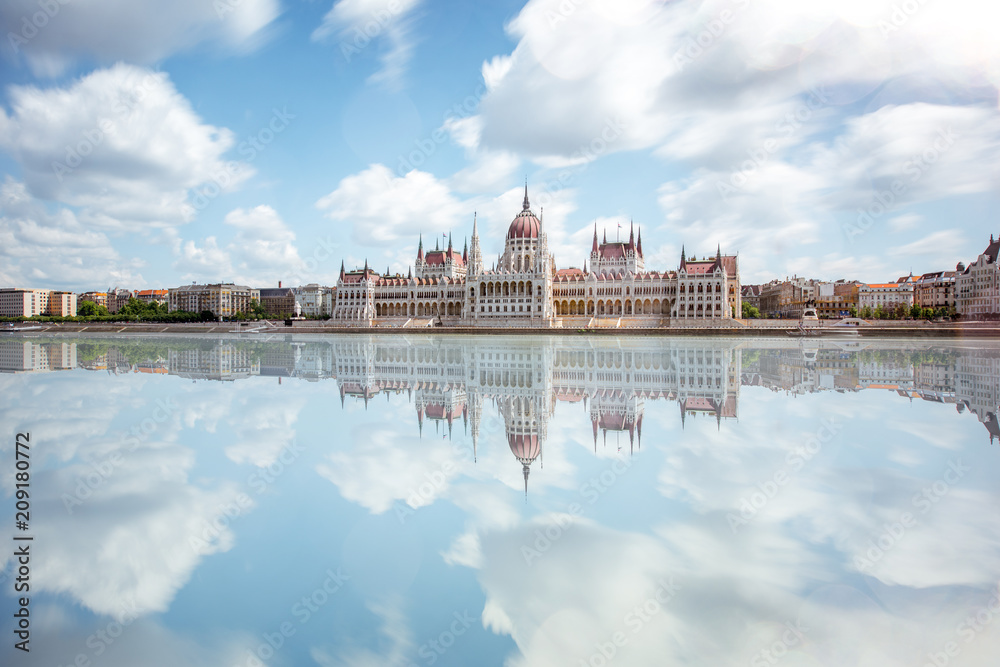 View on the riverside with Parliament building during the daylight in Budapest city. Long exposure image technic - obrazy, fototapety, plakaty 