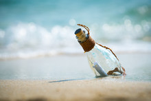 Letter Message In A Glass Bottle On The Beach , Concept For Communication.