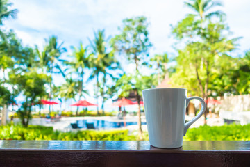 Canvas Print - Hot Coffee cup with beautiful tropical outdoor view