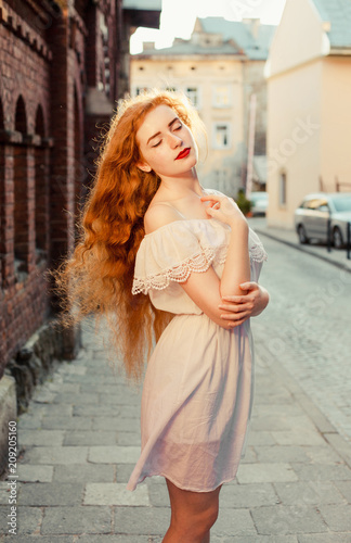 Tender Ginger Girl With Long Hair Wearing White Dress With Naked