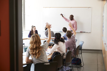 Wall Mural - View Through Doorway Of High School Tutor At Whiteboard Teaching Class